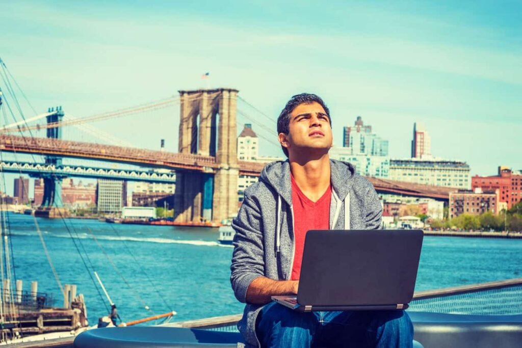 Man working on laptop in NYC