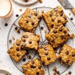 peanut butter banana breakfast cake cut into squares on a wire rack